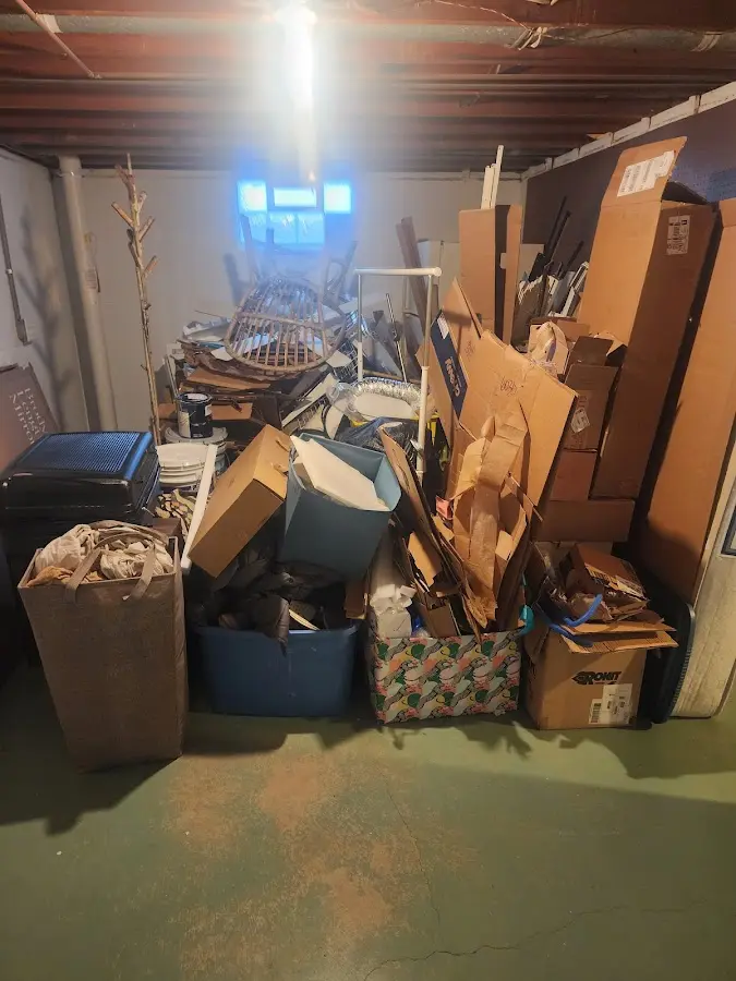 Roll-off dumpster container at job site for 2 Yard Dumpster Rental in Masonville